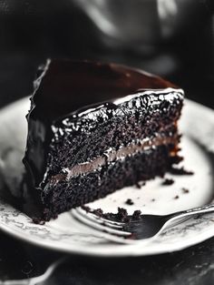 a slice of chocolate cake on a white plate