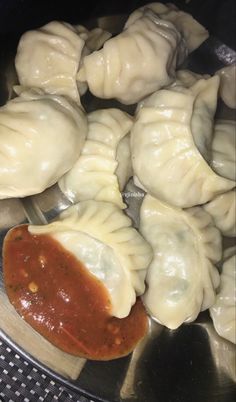 some dumplings are being cooked in a pan