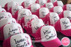 pink and white hats with names on them