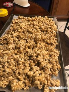 a pan filled with cereal sitting on top of a table