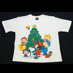 a charlie brown christmas tree t - shirt with peanuts around it and other characters on it