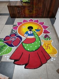 a colorful painting on the ground in front of a counter