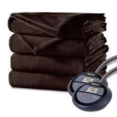 a stack of blankets and a thermometer on a white background