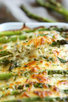 asparagus and cheese casserole in a white dish