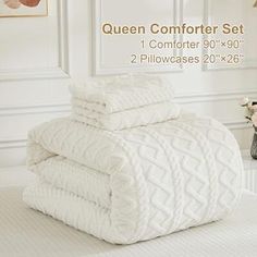 the queen comforter set is white and has two pillowcases 20 x 28