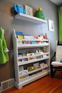 a child's book shelf with books on it