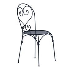 an iron chair with a black seat and back