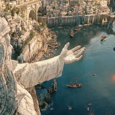 an aerial view of the statue of liberty in front of a city with boats and ships