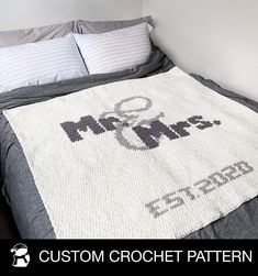 a crocheted blanket with the words mr and mrs on it in black and white