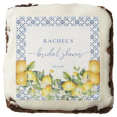 a cake with frosting and lemons on it that says rachel's bridal shower