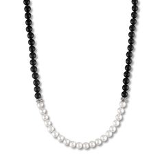 Lustrous freshwater cultured pearls are embraced by striking natural onyx beads in this vibrant men's necklace. Sterling silver Freshwater cultured pearls Natural black onyx The 28-inch necklacesecures in place with a lobster clasp. The signature "E" is stamped on the clasp to identify each piece as part of the 1933 by Esquire men's collection. Classic Black Pearl Chain Necklace, Jared The Galleria Of Jewelry, Onyx Necklace, Onyx Bead, Men's Necklace, Freshwater Cultured Pearls, Necklace Sterling Silver, Natural Pearls, Cultured Pearls