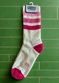 All accessories are final sale Takin' it back to the '80s with these retro socks! Features a more relaxed fit for ultimate comfort and a gentle feel around the calf. Wear them pulled up or scrunched down. Made of natural cotton with accents of fuchsia, flash pink, and dark pink nylon. Super comfy, unisex, one-size-fits-most, and made in the USA. Note: Cream portion is made of natural cotton, so lil darker specks in the fabric will occur. Features: Unisex Gym Crew Socks Wide Rib knit Cushioned fo Retro Socks, Retro Gym, Back To The 80's, Knitted Cushions, Ankle Length Skirt, Fun Socks, Pink Socks, Girl Bands, Cool Socks