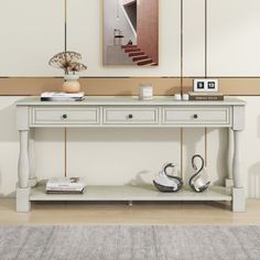 a white table with shoes on it in front of a wall and stairs leading up to the second floor