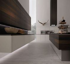 a long white and brown kitchen with lots of counter space