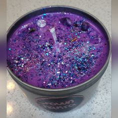 a cup filled with purple and blue liquid