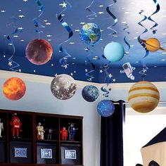 an image of a room with planets and stars on the ceiling in this children's room