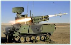 an army tank with missiles shooting at it