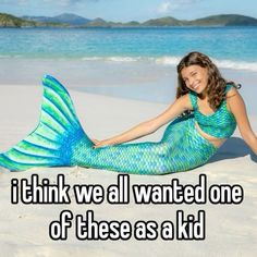 a woman laying on top of a sandy beach next to the ocean with a message that reads, i think we all wanted one of these as a kid