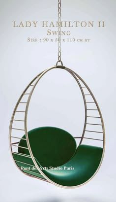 a green chair hanging from a metal chain with the words lady hamilton ii on it