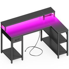 a computer desk with a purple light on top