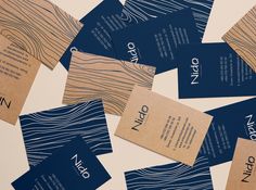 many business cards are stacked on top of each other, with the word nio printed on them