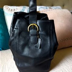 Vintage From The 1990s. Absolutely Stunning Vintage Black Coach Shoulder Leather Backpack. The Most Stunning Shade And Luxe, Supple Leather, Made In Usa Quality. Featuring Stunning Solid Brass Hardware, With The Most Beautiful Front Buckle Magnet Closure. Original Hang Tag Included. The Back Shoulder Strap Is Adjustable, Has A Back Zipper Closure That Opens Into The Middle Compartment, And A Top Clasp That Can Be Held As A Clutch. Such An Incredibly Rare, Designer Find. Measurements Are Approxim One Shoulder Backpack, Bags Vintage, Shoulder Backpack, Back Shoulder, Coach Leather, The 1990s, Vintage Wear, Brass Hardware, Coach Bags