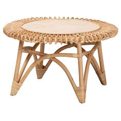 a wicker coffee table with white top and beige cushioning on an isolated white background