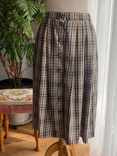 Beautiful 80's trachten plaid skirt with pockets and gorgeous decorative buttons. Fabric: 33% viscose, 67% polyester  Fits best size S, seen S on the model. In a very good vintage condition. No label with a brand name, vintage piece from the 80s Care instruction: Select a Delicate Cycle Iron on a Low Setting Use a Mild Detergent Please reach out with any questions! I respond quickly and I love hearing from you! ♥Thank you for visiting my store!♥ Vintage Midi Skirt, Skirt With Pockets, Decorative Buttons, Plaid Skirt, Plaid Skirts, Skirts With Pockets, Cottage Core, Austria, Tartan