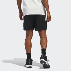 Cut to a mid-rise, these men's adidas basketball shorts are made from a breathable, soft, recycled fabric that goes beyond sport. They have an elastic-drawstring waist, side pockets, and three stripes. Wear them with a hoodie and sneakers for a casual look.Front Style: Flat FrontClosure Type: Drawstring, Full ElasticFit: Regular FitPockets: 2 Side Slip PocketsRise: Mid RiseShort Length: Mid LengthFiber Content: 100% Recycled PolyesterFabric Description: WovenInseam: 9 InCare: Machine Wash, Tumbl Casual Adidas Breathable Bottoms, Casual Breathable Adidas Bottoms, Adidas Relaxed Fit Sports Shorts, Adidas Logo Athleisure Shorts For Streetwear, Adidas Logo Shorts For Streetwear, Adidas Nylon Activewear For Sports, Adidas Logo Streetwear Shorts, Adidas Athletic Shorts With Logo For Streetwear, Adidas Athletic Shorts For Streetwear