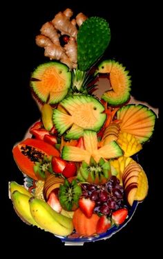 a plate filled with lots of different types of fruits and veggies on top of each other