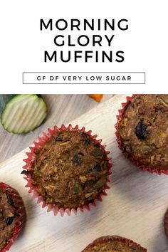 several muffins sitting on top of a cutting board next to sliced cucumbers