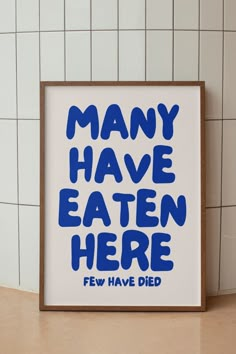 a blue and white poster with the words many have eaten here few have died on it