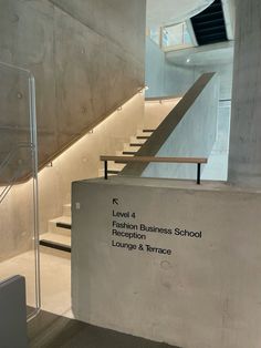 there is a sign that says level 4 on the wall next to some stairs and railings