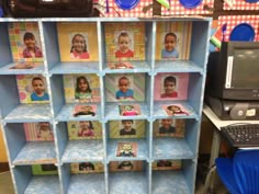 there are many pictures on the shelves in this school room that is decorated with children's faces