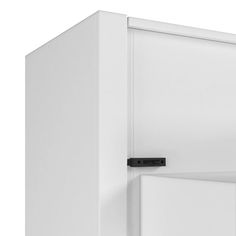 a white refrigerator freezer sitting on top of a wooden floor next to a wall