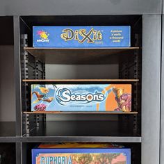 the shelves are filled with different types of board games, including drex it and season's