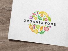 the logo for organic food is shown on a piece of white paper with colorful lettering