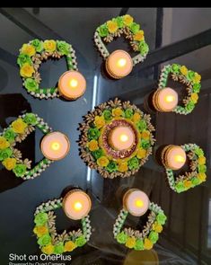 candles are arranged in the shape of hearts and flowers