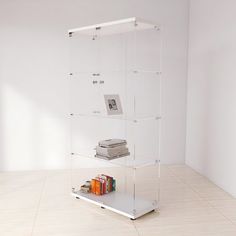 a glass shelf with books on top of it