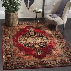 a red rug with an ornate design on the floor in front of a chair and potted plant