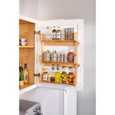 Organizing your favorite array of kitchen spices just got easier with the Rev-A-Shelf 18'' Cabinet Door Mount Wood 3-Shelf Storage Spice Rack. Best in its class, this cabinet spice rack maximizes space and efficiency in your kitchen. You can keep spices within reach in any 30'' tall wall cabinet with a minimum 14.75'' opening. The attractive wood construction features a durable clear finish and chrome rail accents for a modern touch. The 3 fixed shelves have 7'' of height between them and the Door Mount brackets allow for up to 5'' of width adjustability. All hardware is included for easy and simple installation. Double check your cabinet's opening to allow the best fit. Measure side to side, front to back, and top to bottom. Double check to make sure your product is within measurements an Door Mounted Spice Rack, Shelf Kitchen Cabinets, Cabinet Spice Rack, Wood Spice Rack, Seasoning Rack, Spice Rack Organiser, Rev A Shelf, Kitchen Cabinet Door, Kitchen Spices