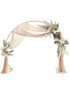 a wedding arch decorated with flowers and feathers