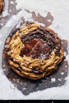 a chocolate chip cookie is on the table