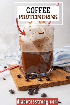 a glass filled with coffee on top of a wooden cutting board next to chocolate chips