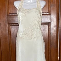 Pronovias Cream 2 Piece Halter Wedding Dress Hand Beaded Bodice Skirt Has Multiple Layers Top And Bottom Fully Lined Easy To Move Around In Size 14 Skirt Needs To Be Dry Cleaned Elegant White Gown With Lace Bodice, Elegant Floor-length Wedding Dress For Ceremony, Elegant White Gown For Mother Of The Bride, Elegant White Mother Of The Bride Gown, Elegant Floor-length Ceremony Gown, Elegant White Mother Of The Bride Evening Dress, Elegant Floor-length Evening Dress For Ceremony, Elegant White Mother Of The Bride Dress For Ceremony, Elegant Cream Evening Dress For Wedding