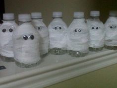 there are many plastic bottles with eyes on them