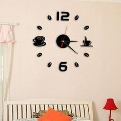 a clock on the wall above a bed