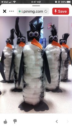 several penguins made out of plastic bottles with googly eyes