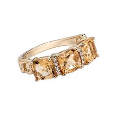 three stone ring in yellow gold with diamonds on the sides and an oval shaped band