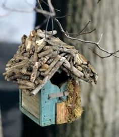 a bird house made out of wood sticks